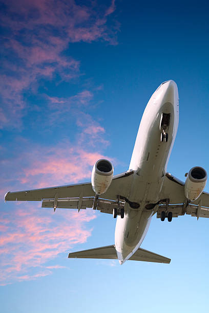 istock Jet Aeroplane Landing From Bright Twilight Sunset Sky Vertical 179304285