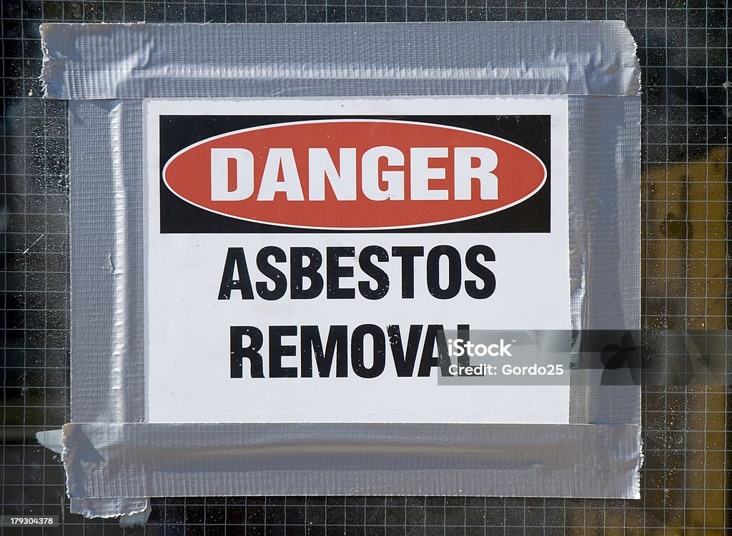 Danger Asbestos Removal Danger Asbestos Removal Sign posted on school window. Asbestos Stock Photo