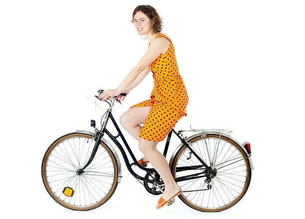 girl riding bicycle stock photo