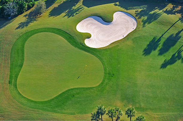 istock golf green and protective sand trap 179305056