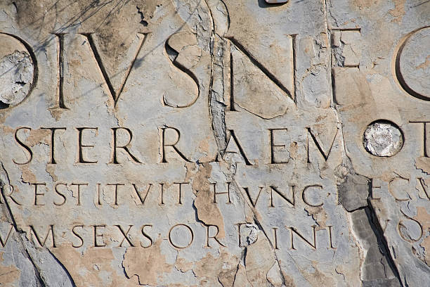 Latin script "Ancient latin script carved into marble. Ruins at Pompeii, Italy." pompeii ruins stock pictures, royalty-free photos & images