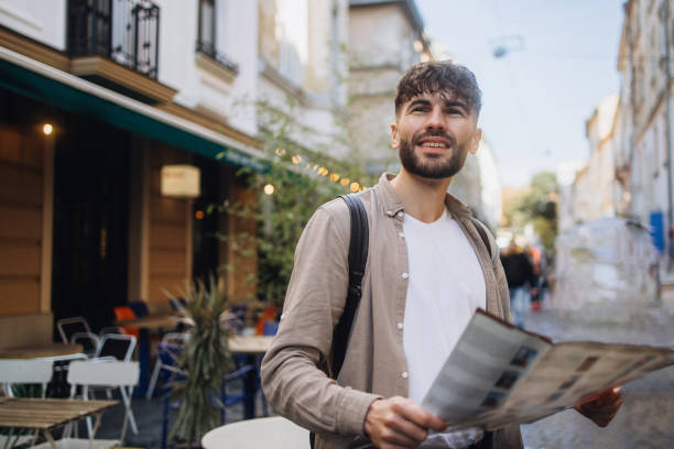 istock The man traveling the city using a tourist map 1793058090