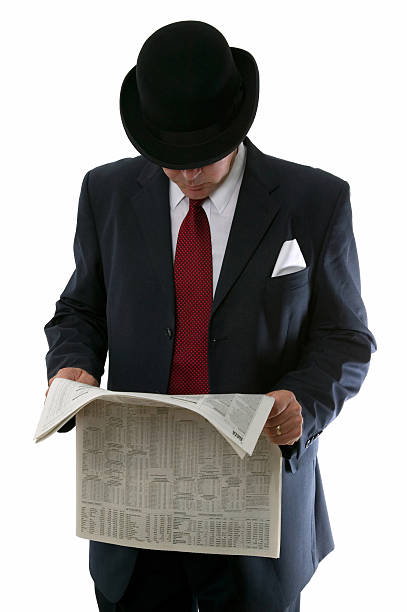 istock Stockbroker reading the paper. 179306258
