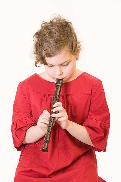 istock girl playing a recorder 179306427