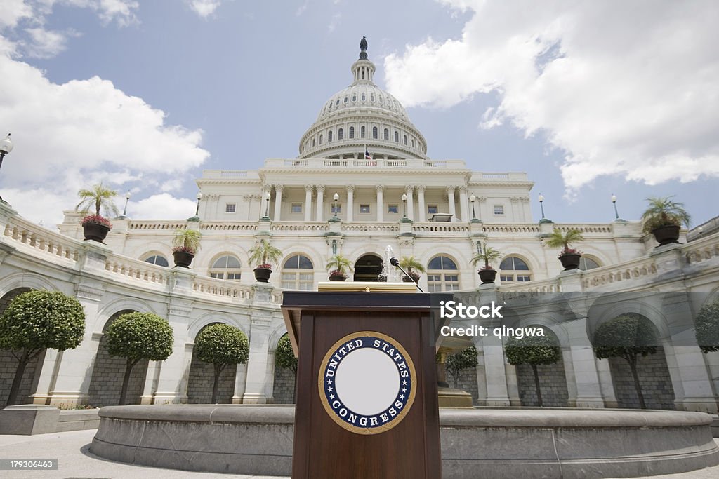 Speechifying US Capitol Building Podium Set Up for Press Conference US Capitol building with a podium set up for a photo op. Presidential Seal Stock Photo