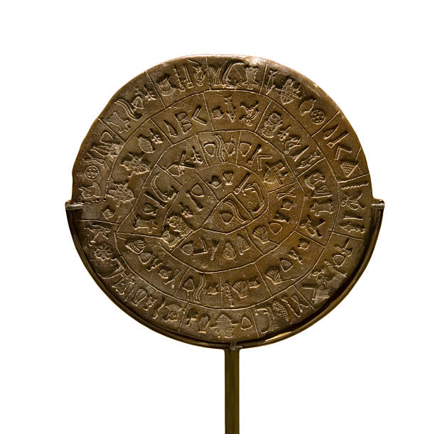 Ancient Minoan Disk Ancient Minoan disk (Phaistos disk) dating 1850 BC. A curious archological find with undeciphered inscriptions minoan photos stock pictures, royalty-free photos & images