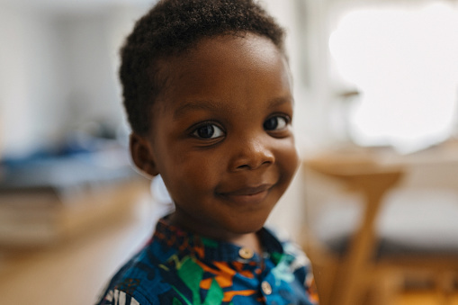 Portrait of adorable black little looking at camera