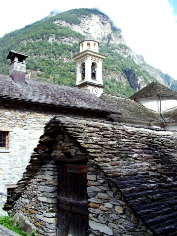 Digital photo of a little village with the name Sonogno at the end of the verzasca-valley in switzerland. The houses in the village are build out of stone and the roofs are build out of granite. This is typical for that part of the switzerland.