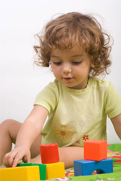 istock girl plays with her building blocks 179307481