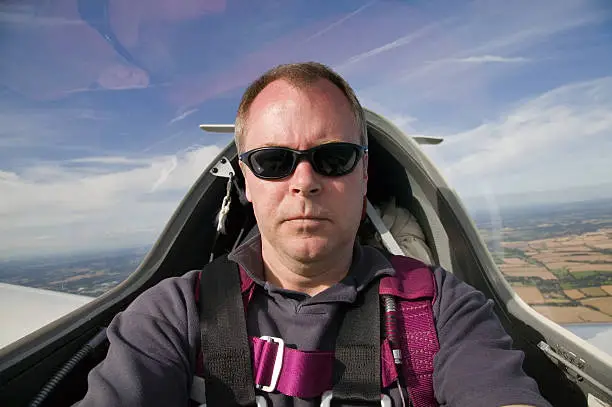 Man inside the cockpit of a glider at 3000 feet.