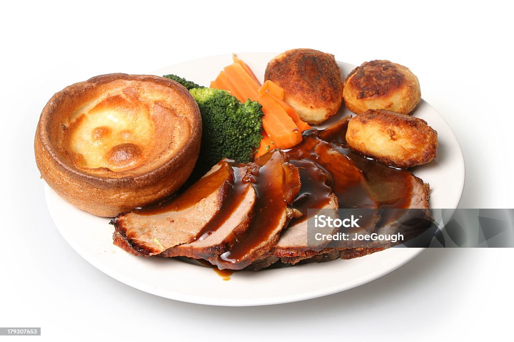 Delicious roast beef dinner for special occasions Traditional British Sunday roast beef dinner with Yorkshire pudding Yorkshire Pudding Stock Photo