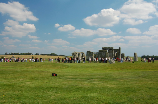 tourist on que and taking photos in stonehenge