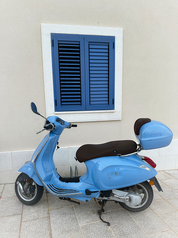 Nostalgic blue motor scooter. Croatia. Mediterranean Sea. Adriatic.