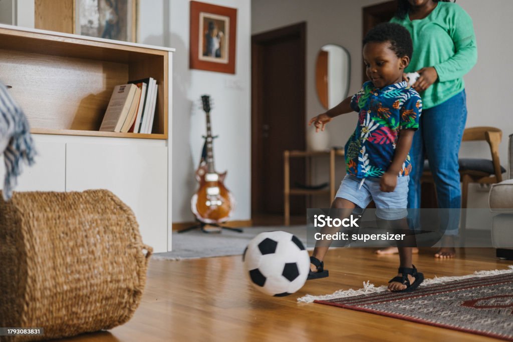 My fav player Son scoring in a basket using soccer ball 2-3 Years Stock Photo