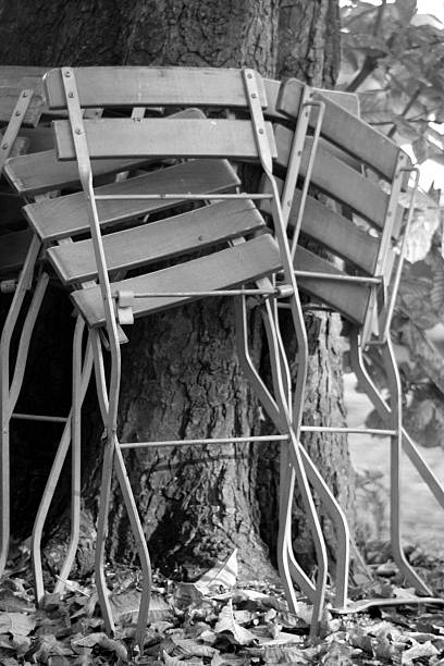 istock lawn chairs leaning against a trunk 179308775