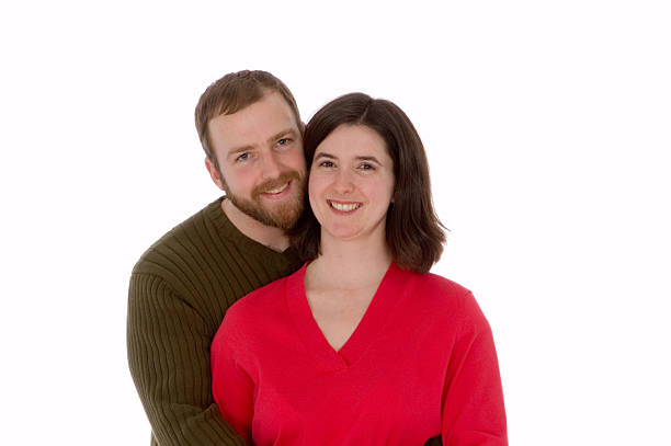 Husband embraces wife. Isolated on white.