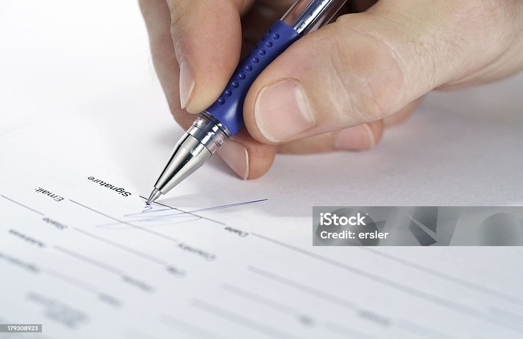signature view of some man signing very important contract Agreement Stock Photo