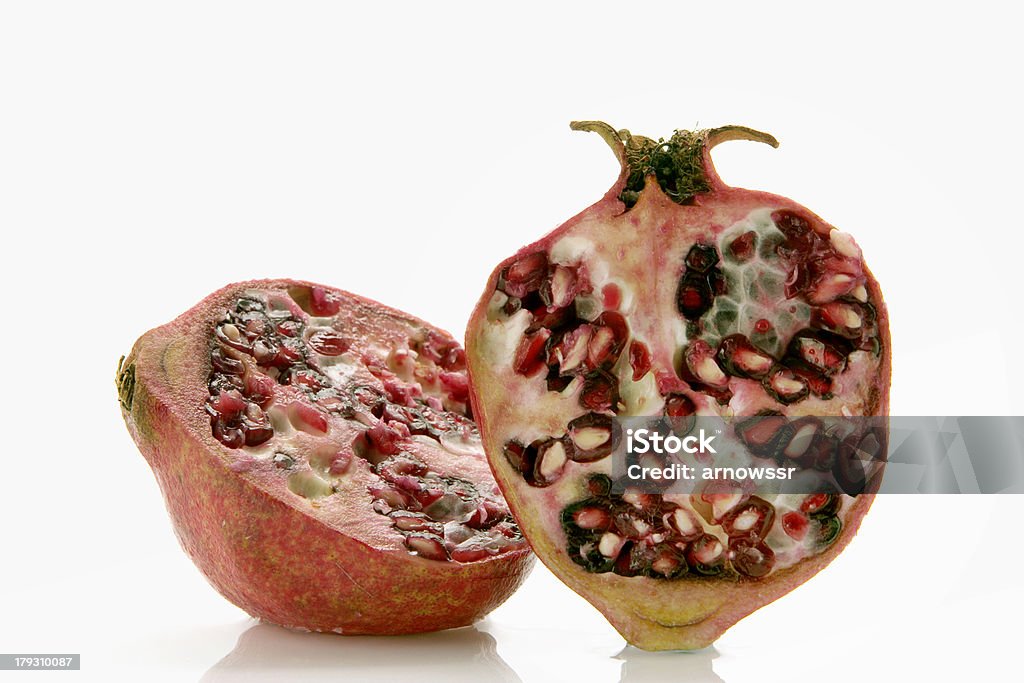 pomegranate freshly sliced pomegranate over white background Circle Stock Photo