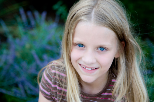 Close up headshot portrait of little girl