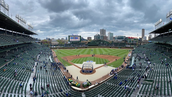 Chicago - April 23, 2023: Wrigley Field Home of Chicago Cubs panorama on a dark, gloomy and cold April game. Wrigley Field has been home to the Cubs since 1916.