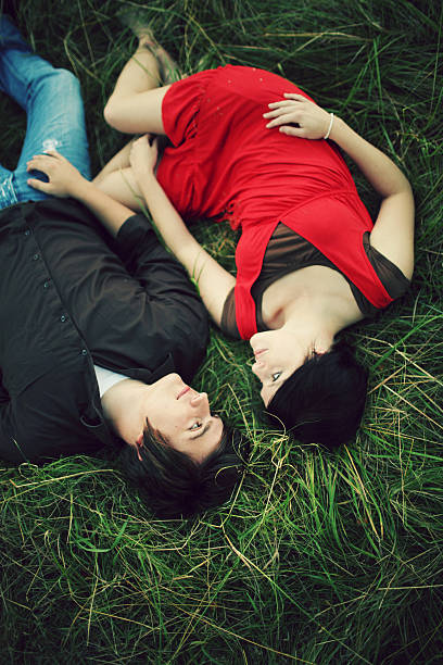 istock Green Grass Couple Laying along Side Eachother 179312019