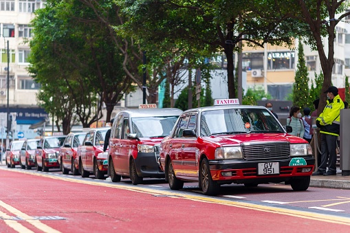 Hong Kong, Hong Kong – March 15, 2023: The Famous Red Taxis in Hong Kong Times Square