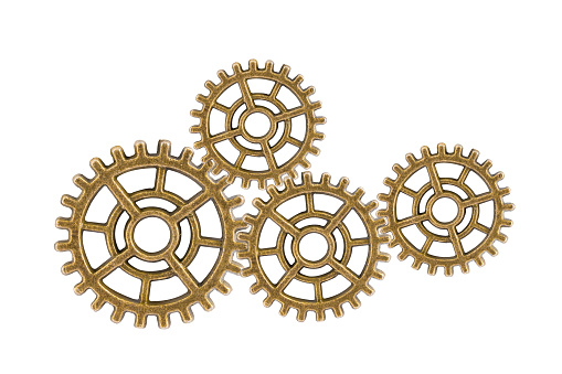 Gear and cogs wheels isolated on a white background, clock mechanism, brass metal engine industrial.