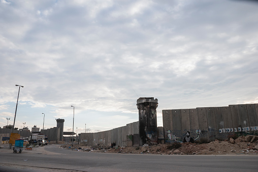 Qalandia, West Bank - November 14, 2006: Vehicles wait to cross out of the West Bank at the Qalandia checkpoint between Ramallah and Jerusalem.