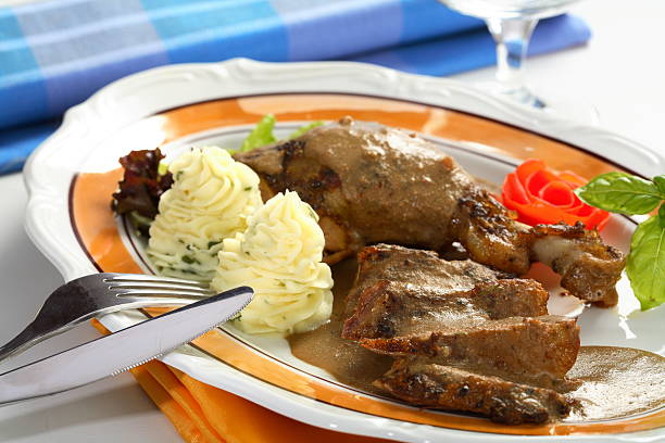 istock Oven pork with potatoes on the plate 179312678