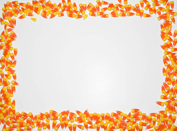 Border - Candy Corn "A Halloween border of colorful candy corns. Great for invitations!Color space is ProPhoto, RGB, processed from a 16 bit RAW image.View Similar Images Here:" candy corn stock pictures, royalty-free photos & images