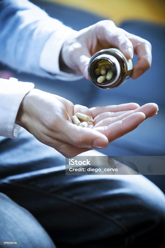 pills healthcare and medicine: man taking a painkiller Addiction Stock Photo