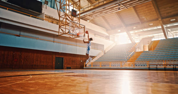 istock Man throwing basketball towards basket 1793136468