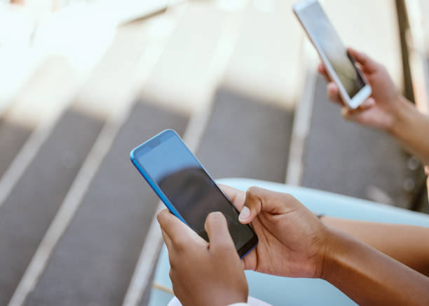 istock Chat, networking and smartphone in friends hands for social media, mobile app software and digital surfing outdoor. Zoom of 5g cellphone screen for internet search, typing online or check blog update 1793142449