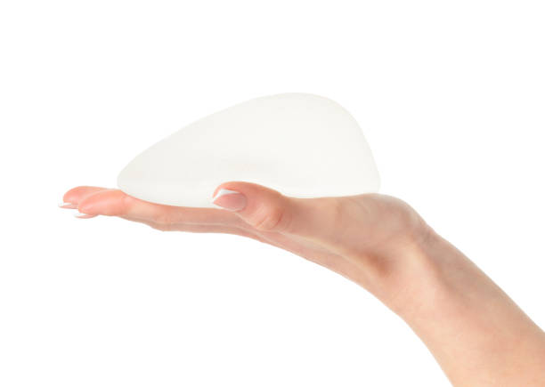 istock Anatomical implant in hand isolated on white background with clipping path. 1793148881
