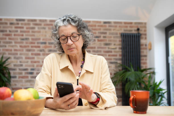 istock Woman using a smart phone at home 1793160589
