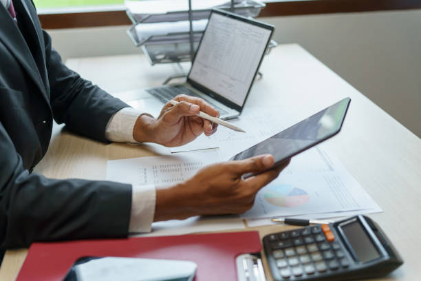 istock Businessman Accountant analyzing investment charts Invoice and p 1793161348
