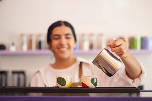 Young woman serving espressos