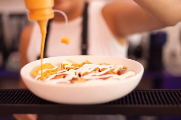 Young woman preparing delicious chilaquiles