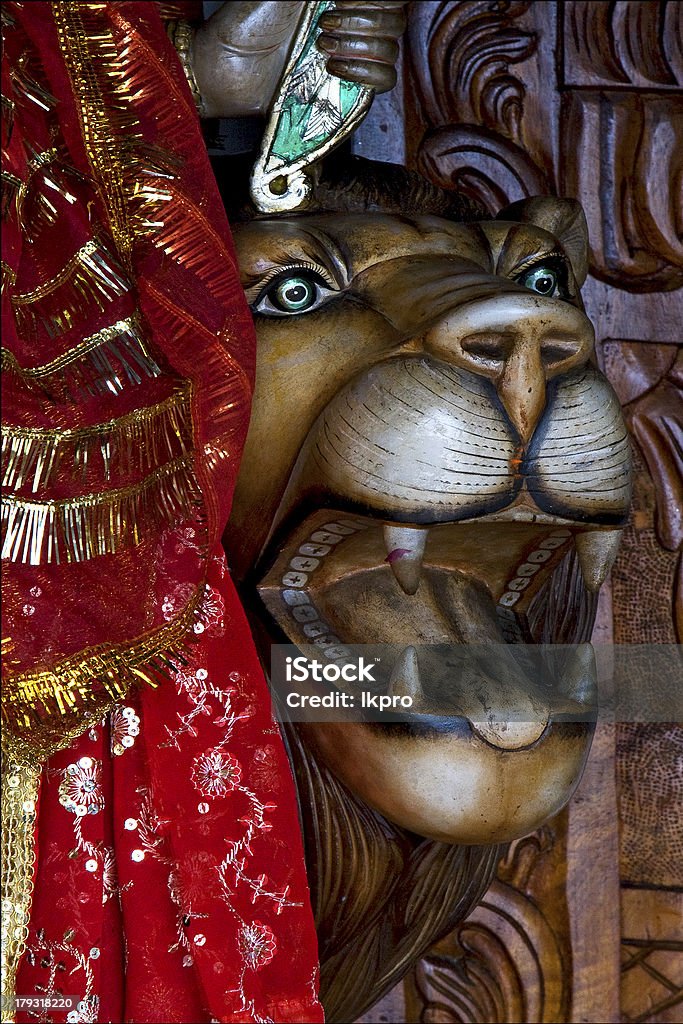 Hinduism  head of lion head of lion precious stone marble  wood statue of a Hinduism  women  Shiva vishnu Brahma in a temple near a lake in mauritius africa. Africa Stock Photo