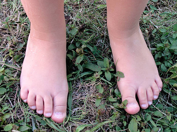 istock Bare feet of a baby 179318300