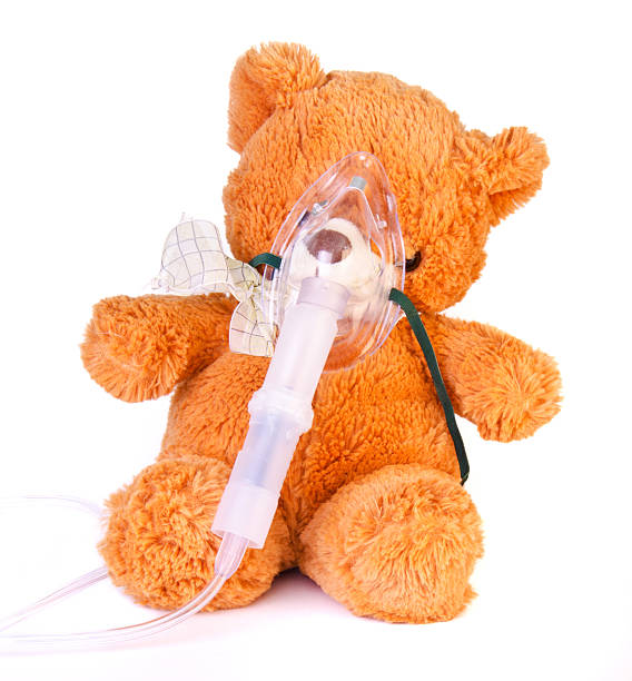 Oxygen mask on a bear stock photo