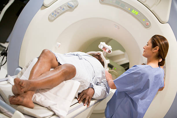 istock Nurse With Patient Prepare For A Computerized Axial Tomography 179318952