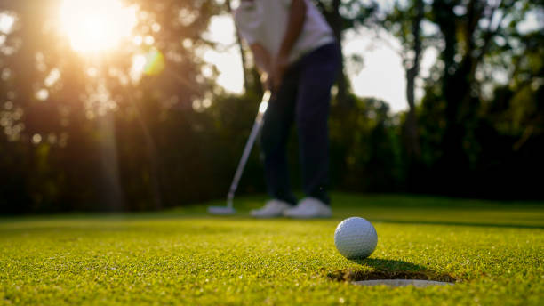 istock Blurred golfer playing golf in the evening golf course, on sun set evening time. 1793191353