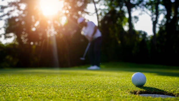 istock Blurred golfer playing golf in the evening golf course, on sun set evening time. 1793191357