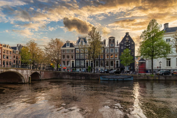 istock Amsterdam Netherlands, sunset city skyline at canal waterfront 1793197764