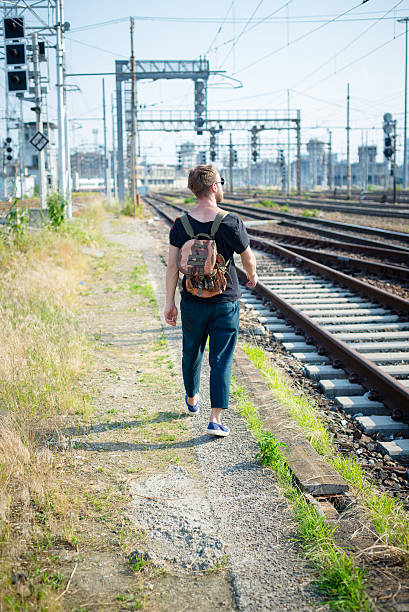 istock hipster modern stylish blonde man on rails 179319787
