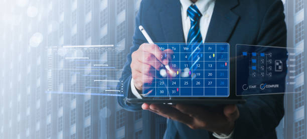Executive-level businessmen examine the organization's work plan. Utilize KPIs to measure achievement and enhance performance. Examine and fix any shortcomings, and quantify the outcomes.
