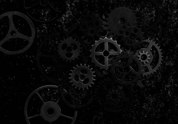 istock Assorted mechanical grunge gears on gritty black background 1793217466