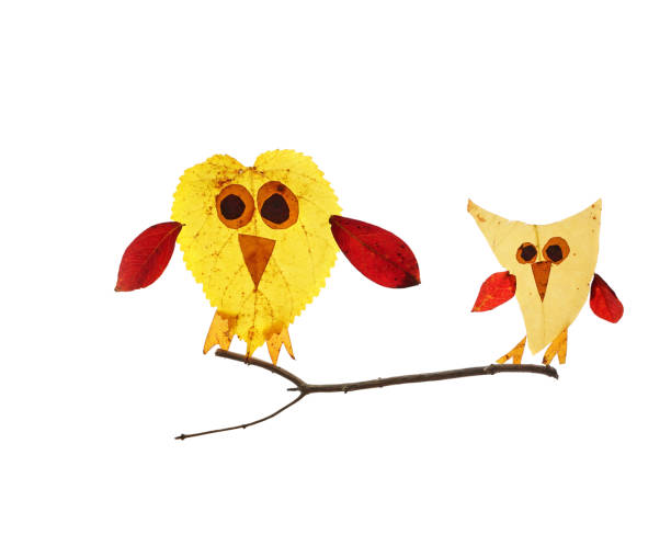 istock Two cute birds made of assorted Autumn leaves , isolated on white 1793223387