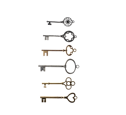 Assortment of vintage keys isolated on white background